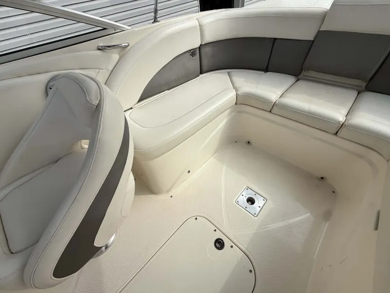 Slide: The Image of Interior of a 2009 Bayliner 225 BR boat with beige seating. - 10