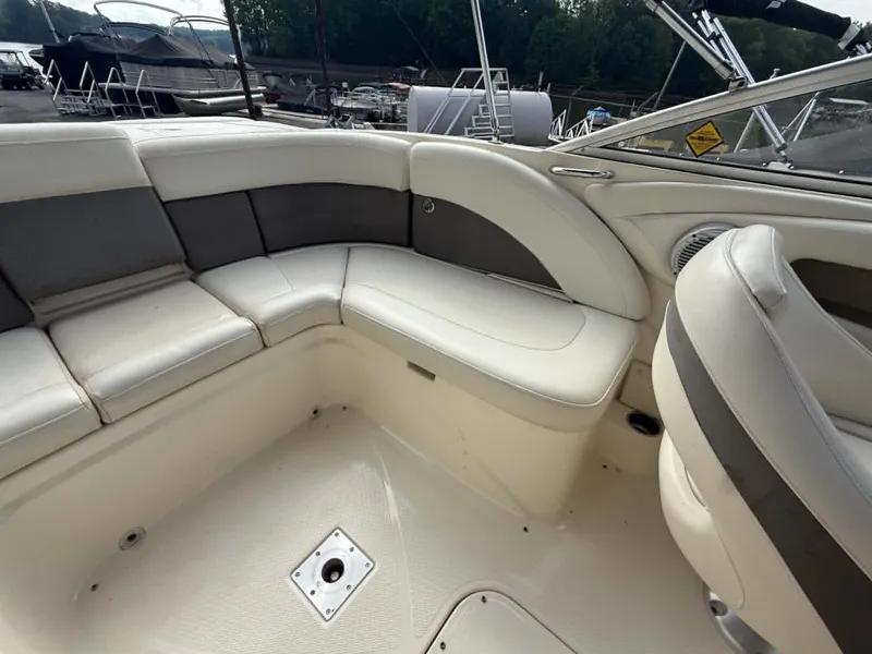 Slide: The Image of Interior of a 2009 Bayliner 225 BR boat with seating area. - 17