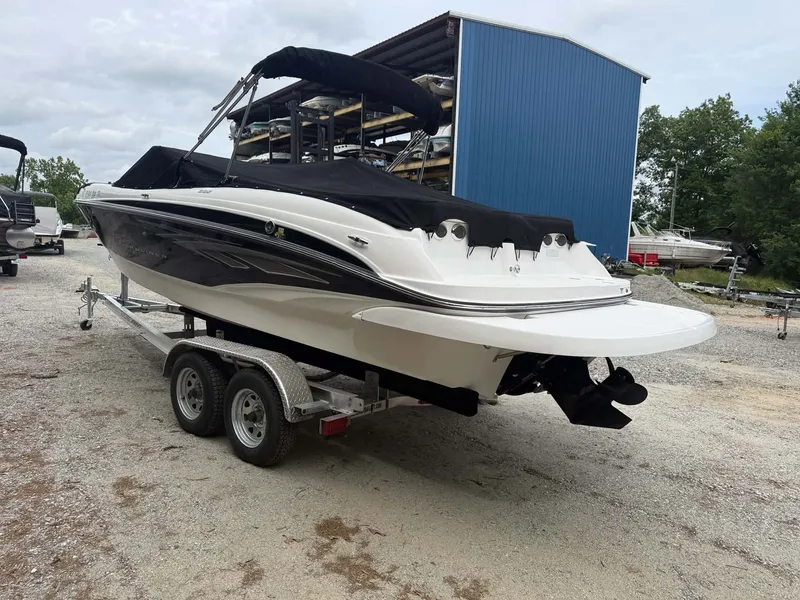 Slide: The Image of 2009 Bayliner 225 BR boat on trailer, side view. - 22