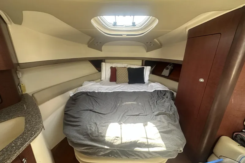 Slide: The Image of Interior cabin of 2009 Boston Whaler 345 Conquest with cozy bed and porthole. - 14
