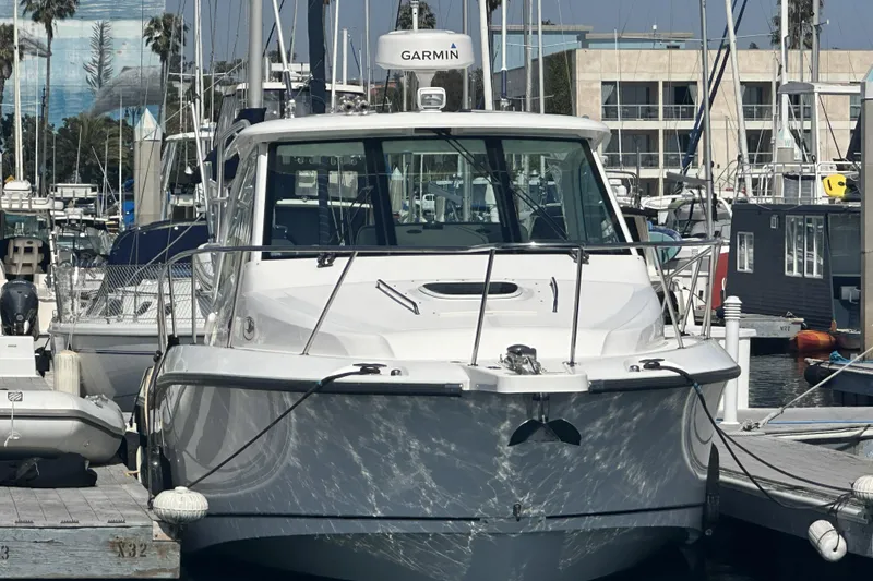 Slide: The Image of 2009 Boston Whaler 345 Conquest docked at marina with Garmin equipment. - 4