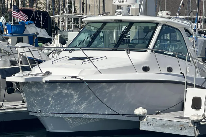 Slide: The Image of 2009 Boston Whaler 345 Conquest boat docked at marina, front view. - 5