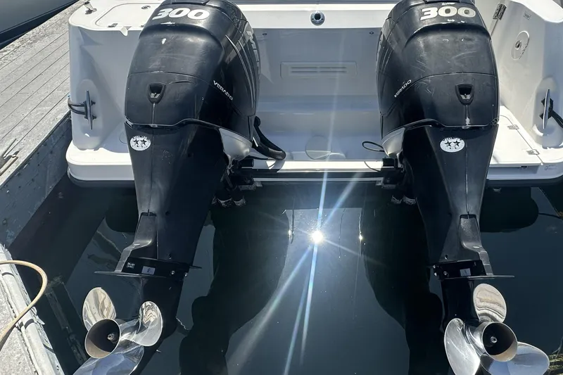 Slide: The Image of Twin 300 horsepower engines on a 2009 Boston Whaler 345 Conquest boat. - 7