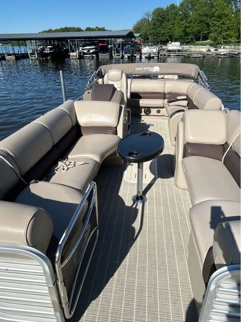Slide: The Image of 2018 G3 EL 326SE pontoon boat with beige seating on a lake. - 8