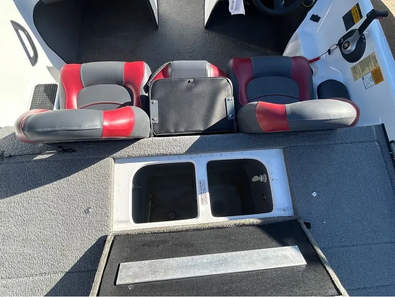 Slide: The Image of Interior of a 2005 Nitro X750 DC boat with red seats. - 5