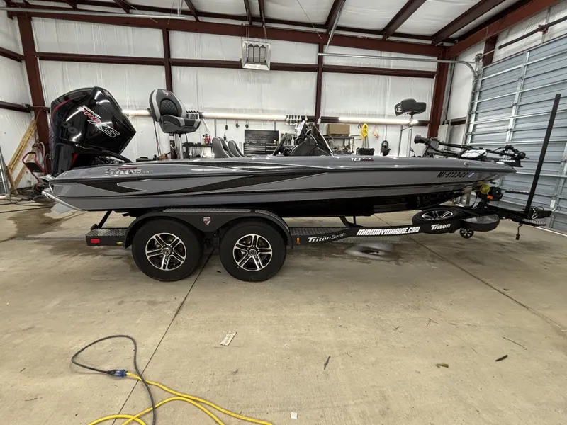 The Image of 2022 Triton 18 TrX boat in warehouse on trailer. - 1