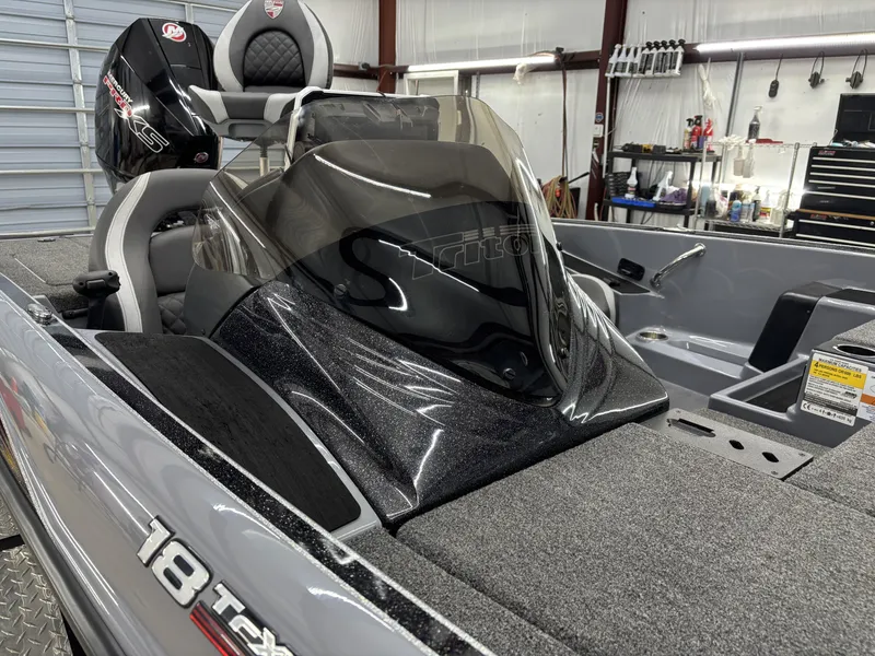 Slide: The Image of 2022 Triton 18 TrX boat inside a workshop. - 10