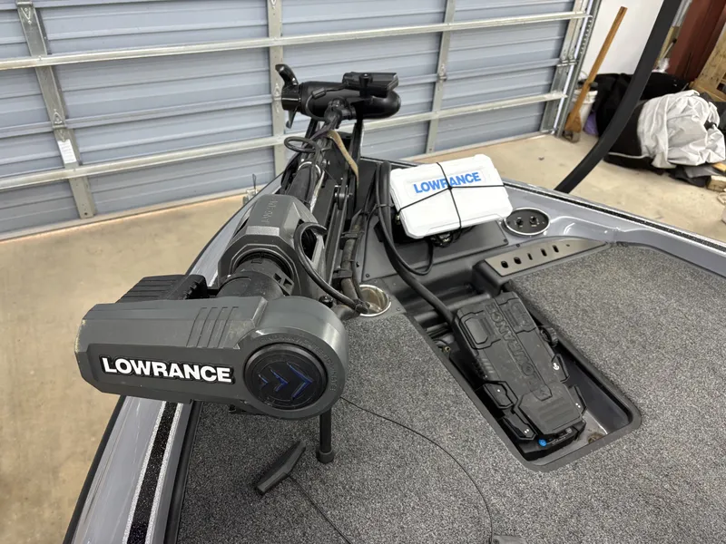 Slide: The Image of 2022 Triton 18 TrX boat with Lowrance electronics in interior. - 13
