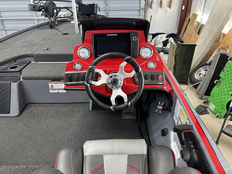 Slide: The Image of Interior of a 2023 Nitro Z18 Pro boat with red dashboard. - 11