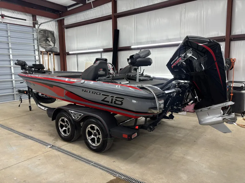 Slide: The Image of 2023 Nitro Z18 Pro boat parked in a garage. - 7