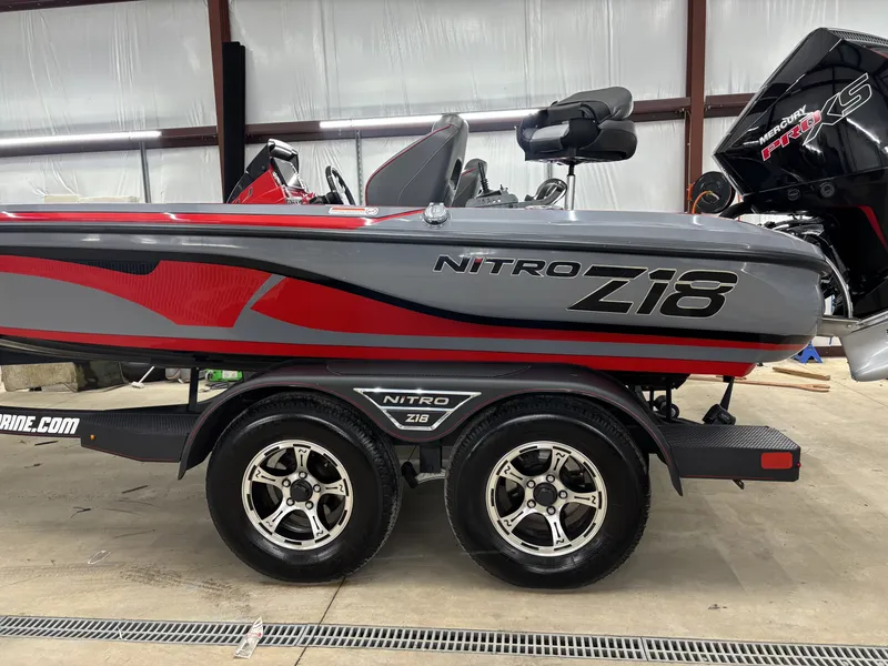 Slide: The Image of 2023 Nitro Z18 Pro boat parked in a garage. - 9