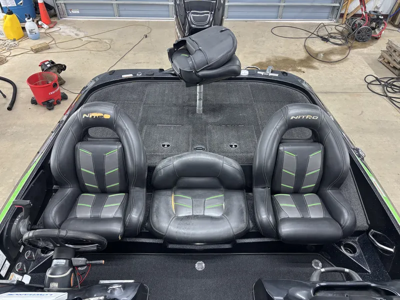 Slide: The Image of Interior of a 2017 Nitro Z19 Pro boat with black seats. - 12