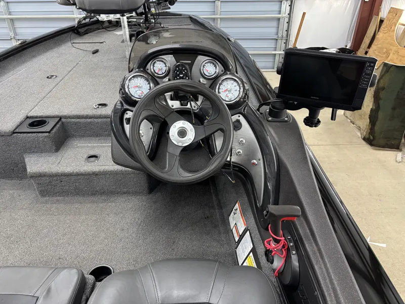 Slide: The Image of Interior of 2023 Tracker 190TX TE with steering and instruments. - 10