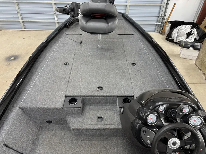 Slide: The Image of Interior view of a 2023 Tracker 190TX TE boat with steering console. - 12