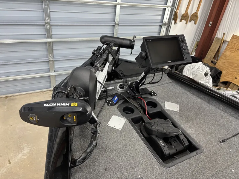 Slide: The Image of 2023 Tracker 190TX TE boat with Minn Kota trolling motor and Garmin display. - 14