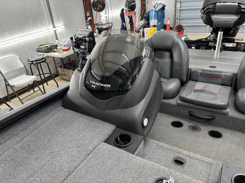 Slide: The Image of 2023 Tracker 190TX TE boat inside a workshop. - 15