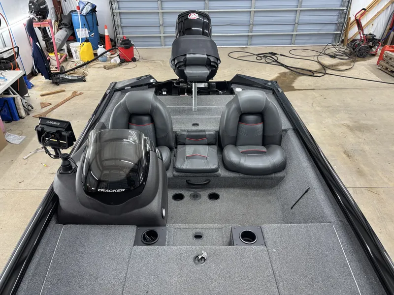 Slide: The Image of Interior view of a 2023 Tracker 190TX TE boat in a workshop. - 16