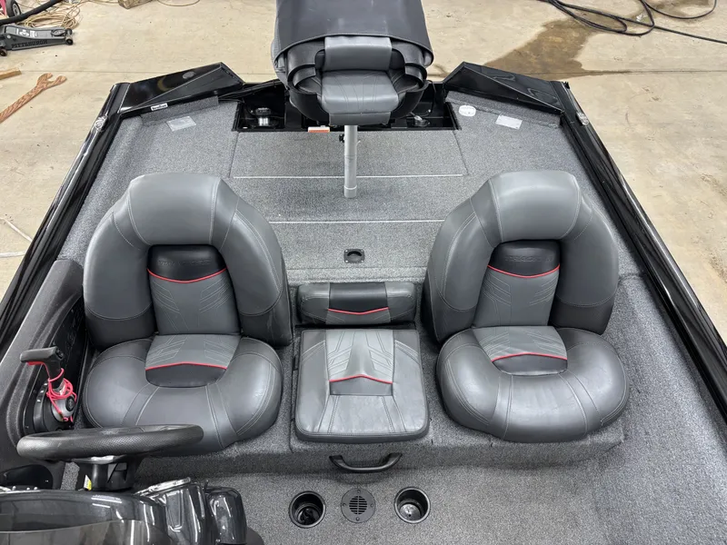 Slide: The Image of Interior of a 2023 Tracker 190TX TE boat with gray seating. - 17