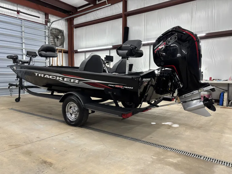 Slide: The Image of 2023 Tracker 190TX TE boat in a garage. - 5