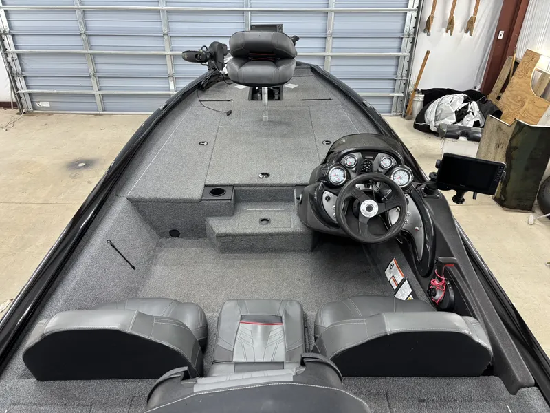 Slide: The Image of Interior view of a 2023 Tracker 190TX TE boat with gray seats. - 8
