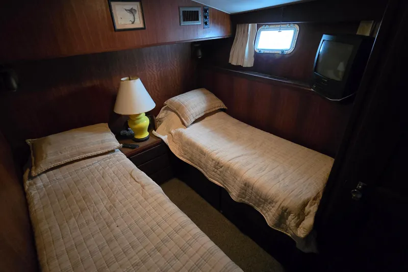 Slide: The Image of Interior cabin of 1975 Hatteras 46 Convertible with twin beds and vintage decor. - 16
