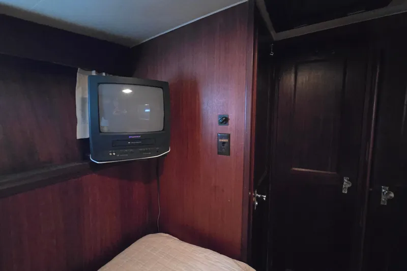 Slide: The Image of Vintage cabin interior of 1975 Hatteras 46 Convertible with wall-mounted TV. - 17