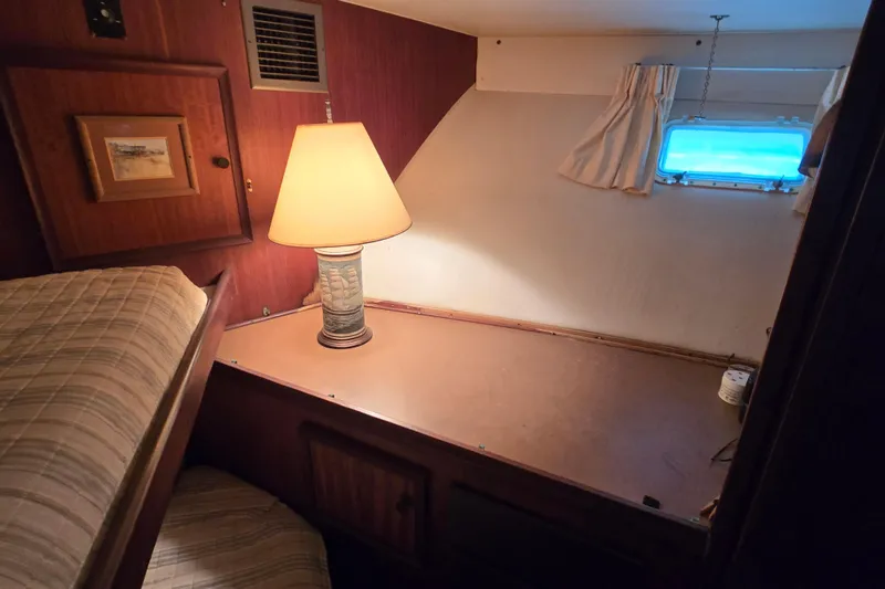 Slide: The Image of Cozy cabin interior of 1975 Hatteras 46 Convertible with lamp and window. - 20