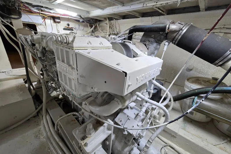 Slide: The Image of Engine room of a 1975 Hatteras 46 Convertible yacht, featuring a Yanmar engine. - 36