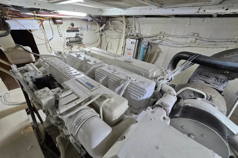 Slide: The Image of Engine room of a 1975 Hatteras 46 Convertible yacht, showcasing detailed machinery. - 39