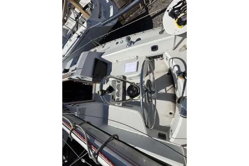 Slide: The Image of 1988 O'Day 302 sailboat cockpit with steering wheel and navigation instruments. - 10
