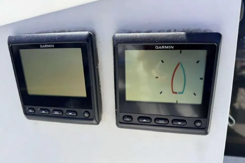 Slide: The Image of Garmin marine instruments on a 1988 O'Day 302 sailboat dashboard. - 14
