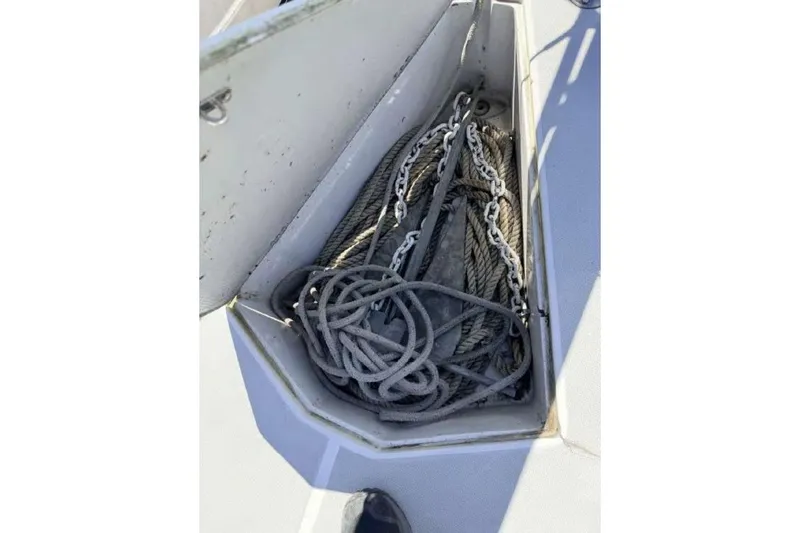 Slide: The Image of Anchor locker with ropes and chains on a 1988 O'Day 302 sailboat. - 18