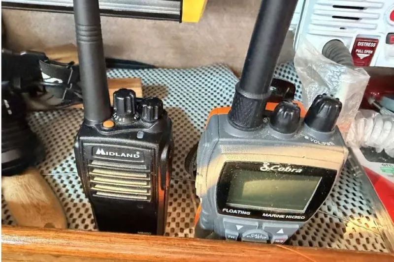 Slide: The Image of Two marine radios, Midland and Cobra, on a 1988 O'Day 302 sailboat. - 23