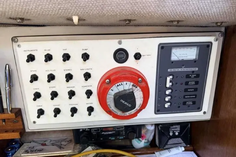 Slide: The Image of Control panel of a 1988 O'Day 302 sailboat with switches and battery gauge. - 24