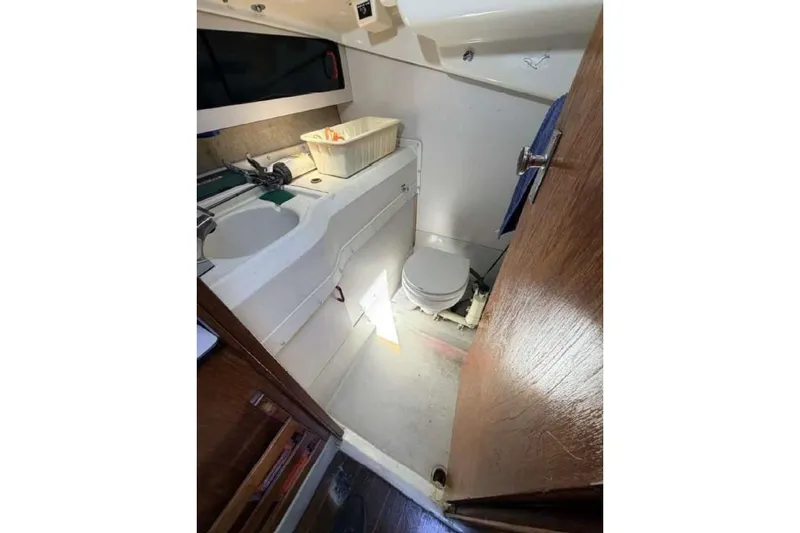 Slide: The Image of Interior of 1988 O'Day 302 sailboat bathroom with sink and toilet. - 27