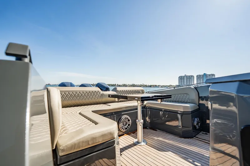 Slide: The Image of Luxurious seating area on 2023 Skipper-BSK 38NC yacht with city skyline view. - 101