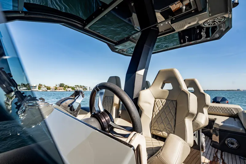 Slide: The Image of Luxurious 2023 Skipper-BSK 38NC boat interior with modern steering and plush seating. - 107