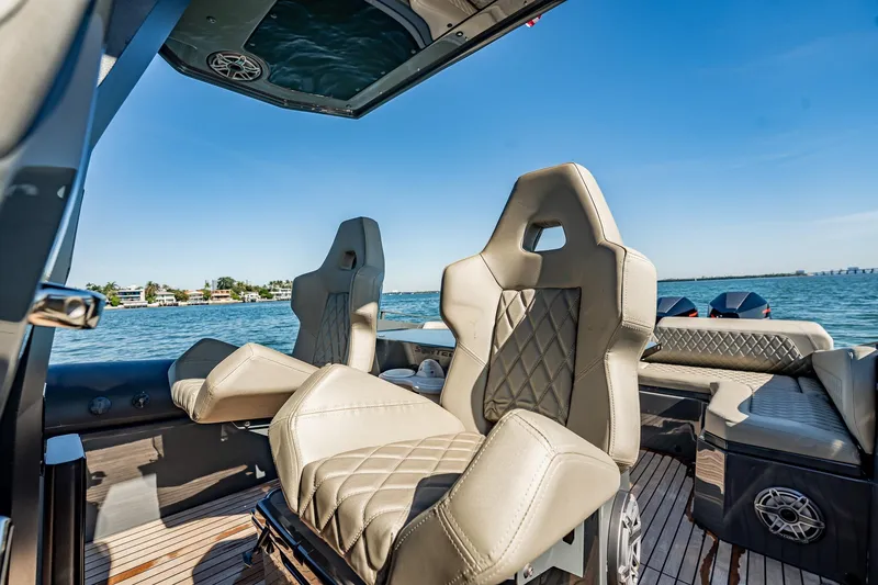 Slide: The Image of Luxurious seating on 2023 Skipper-BSK 38NC boat with scenic ocean view. - 108