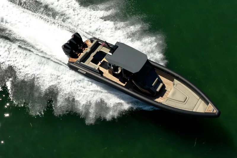 Slide: The Image of Aerial view of 2023 Skipper-BSK 38NC speedboat cruising on water. - 11