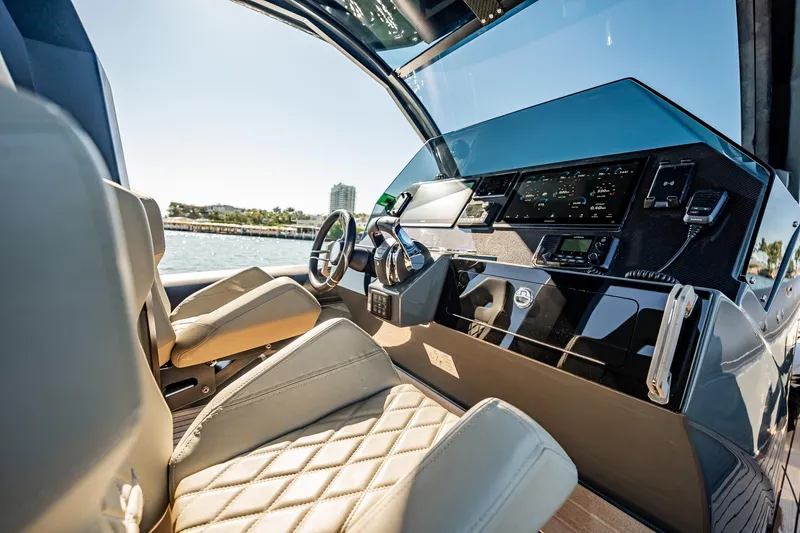 Slide: The Image of Luxurious interior of 2023 Skipper-BSK 38NC yacht with modern dashboard and leather seating. - 110