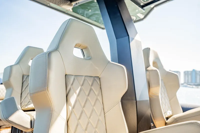 Slide: The Image of Luxurious beige seats on 2023 Skipper-BSK 38NC boat, featuring diamond stitching and modern design. - 112