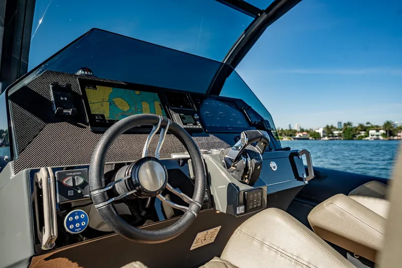 Slide: The Image of Cockpit of 2023 Skipper-BSK 38NC boat with modern navigation system and steering wheel. - 113