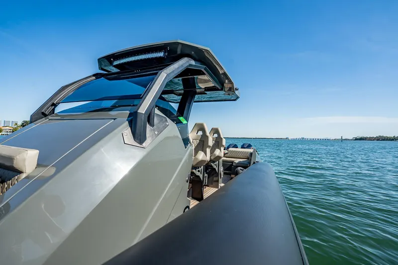 Slide: The Image of 2023 Skipper-BSK 38NC boat on calm water under clear blue sky. - 117