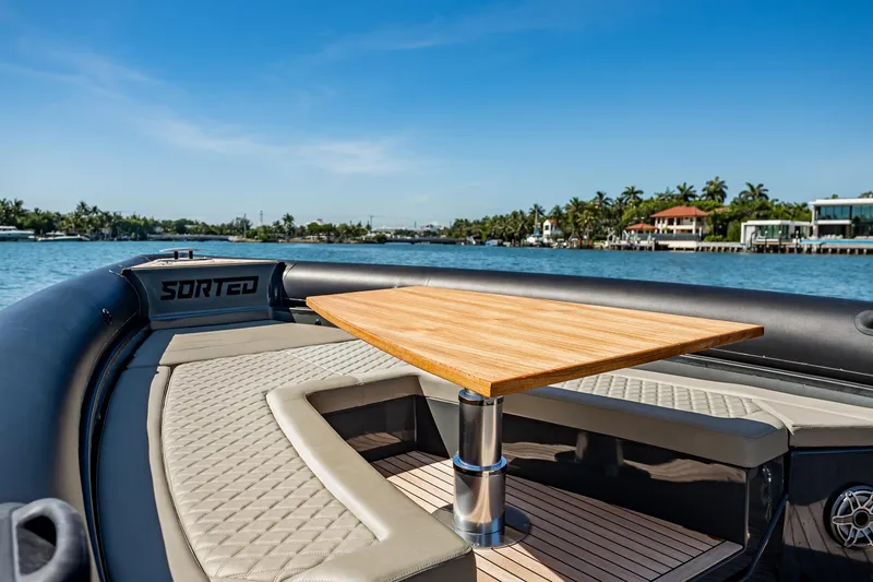 Slide: The Image of Luxurious 2023 Skipper-BSK 38NC boat interior with wooden table and cushioned seating. - 119