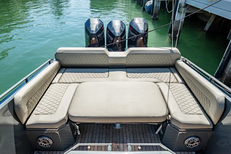 Slide: The Image of Luxurious seating on 2023 Skipper-BSK 38NC boat with triple outboard engines. - 124