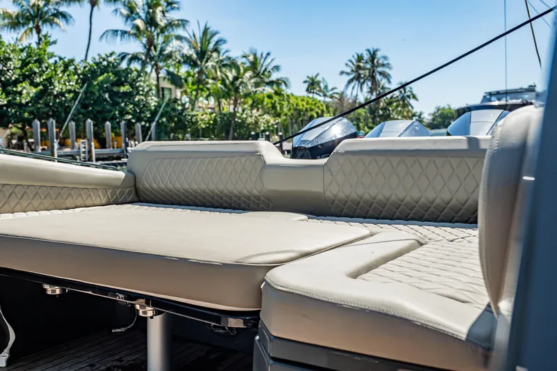 Slide: The Image of Luxurious seating on 2023 Skipper-BSK 38NC boat with tropical backdrop. - 125