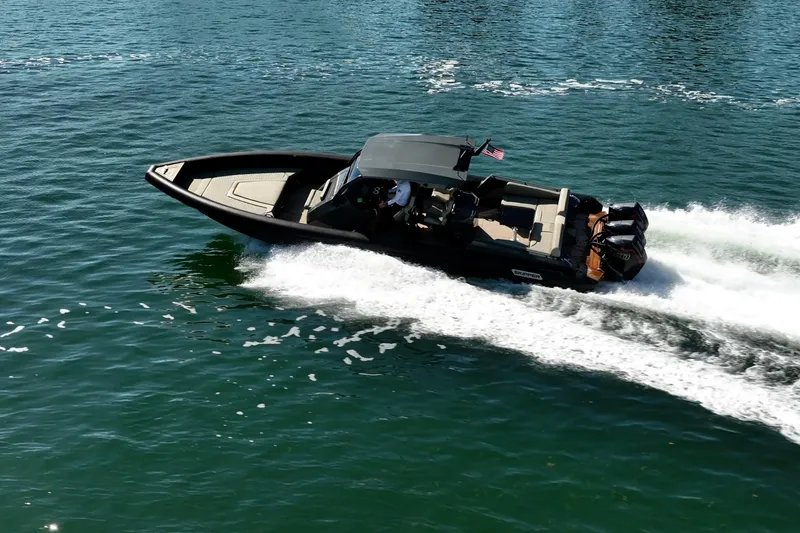 Slide: The Image of 2023 Skipper-BSK 38NC boat cruising swiftly on open water. - 20