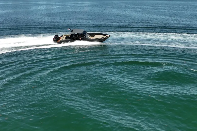 Slide: The Image of 2023 Skipper-BSK 38NC speedboat cruising on open water. - 27
