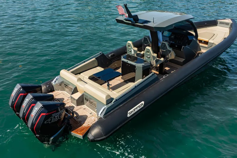 Slide: The Image of 2023 Skipper-BSK 38NC boat with triple outboard engines on clear water. - 32