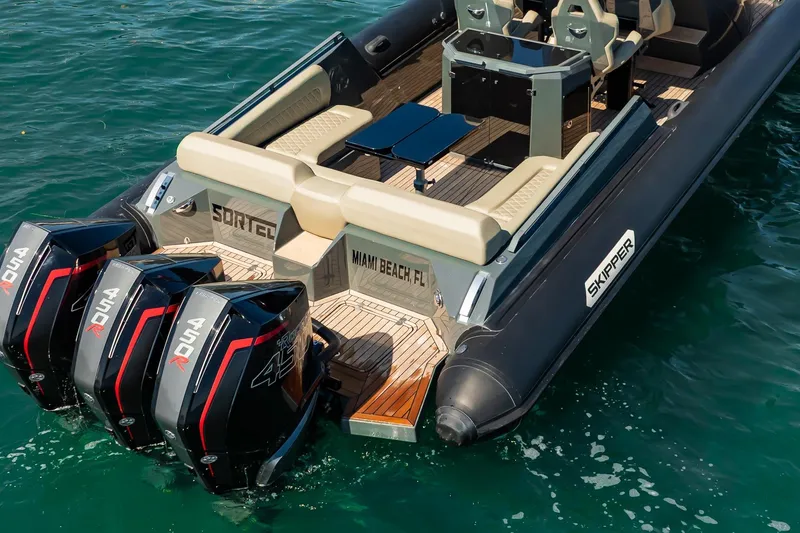 Slide: The Image of 2023 Skipper-BSK 38NC boat with triple 450R engines on water. - 33